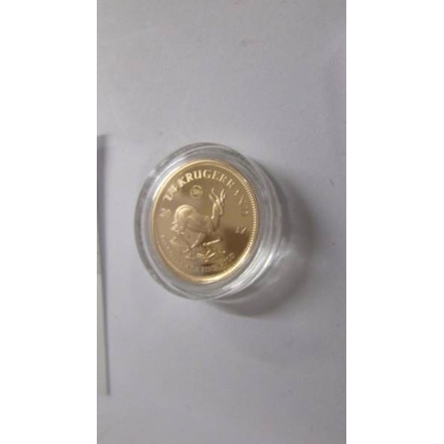 1192 - A boxed 50th anniversary gold proof quarter krugerand.