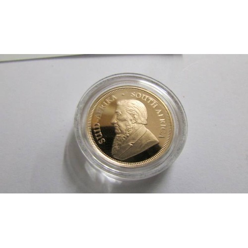 1192 - A boxed 50th anniversary gold proof quarter krugerand.