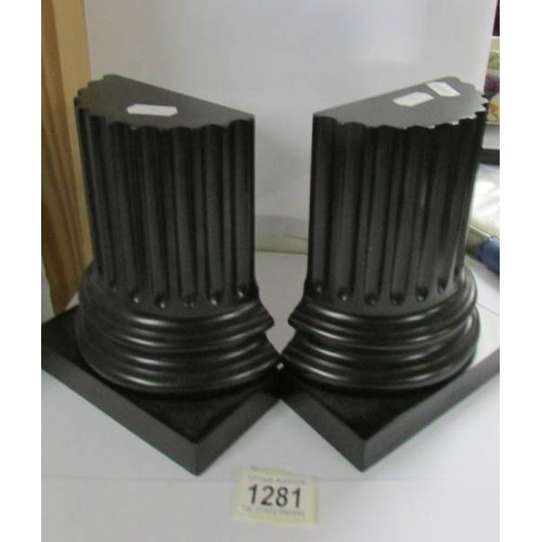 1281 - A pair of David Linley ebonised book ends in the form of neo-classical columns marked Linley.