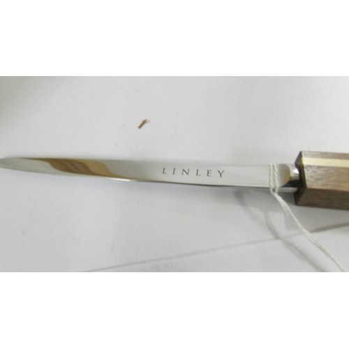 1282 - A David Linley paper knife with walnut and sycamore handle marked Linley.