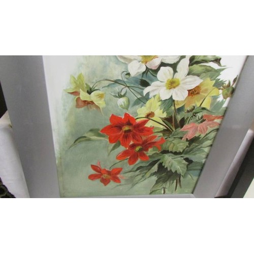 1301 - A framed floral painting on opaque glass, 84 x 47 cm.