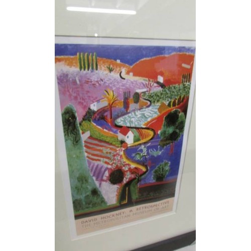 1303 - Two framed and glazed David Hockney (b.1937) poster prints:- The Metropolitan Museum of Art 1988 and... 