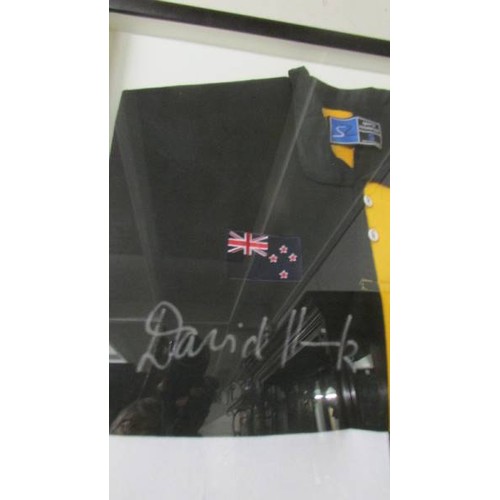 1318 - A framed limited edition shirt personally signed by the world cup winning captain's. COLLECT ONLY