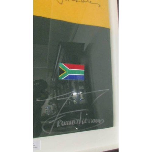 1318 - A framed limited edition shirt personally signed by the world cup winning captain's. COLLECT ONLY