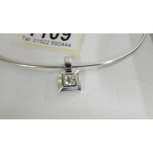 1109 - An 18ct white gold and +1 ct diamond pendant (17 grams)