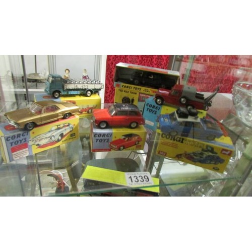 1339 - A selection of playworn Corgi toys in original paint, in reproduction boxes.