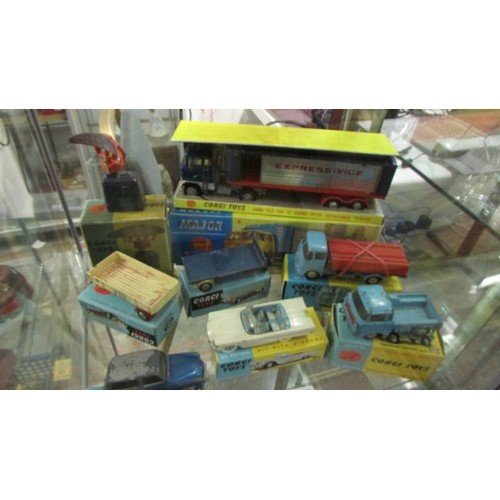 1339 - A selection of playworn Corgi toys in original paint, in reproduction boxes.