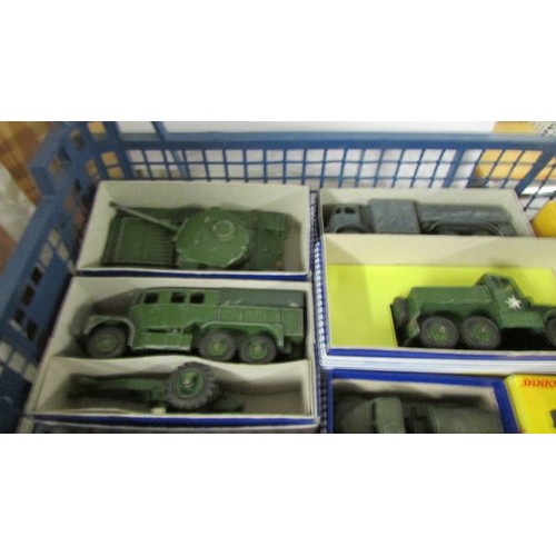 1340 - Thirteen Dinky military vehicles, twelve in reproduction boxes.