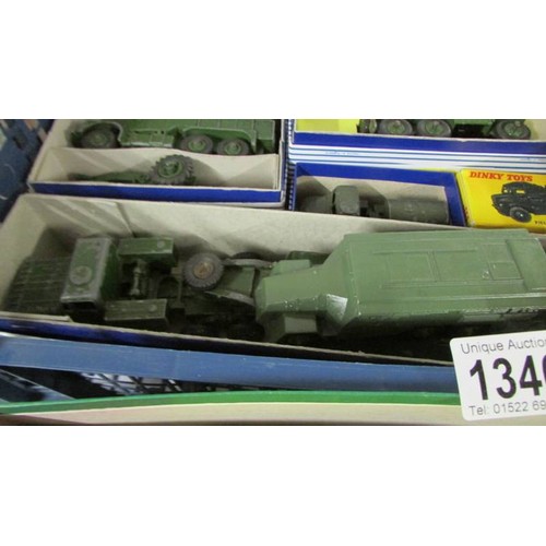 1340 - Thirteen Dinky military vehicles, twelve in reproduction boxes.