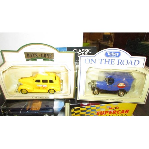 1346 - A mixed lot of boxed die-cast vehicles including Days Gone, Maisto, Classic Cars etc.,