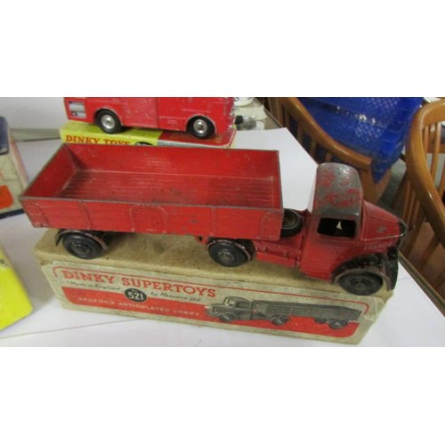 1352 - Three Playworn Dinky Bedford Leyland and two fire engines in original boxes.  276, 521, 531, 555, 40... 