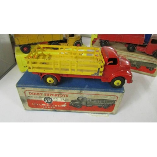 1352 - Three Playworn Dinky Bedford Leyland and two fire engines in original boxes.  276, 521, 531, 555, 40... 