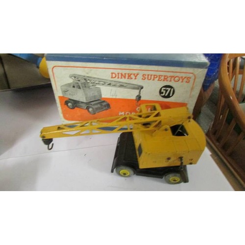 1354 - Four boxed Dinky:- 561, 563, 571, 964, bulldozer, crane, heavy tractor and elevator loader in origin... 