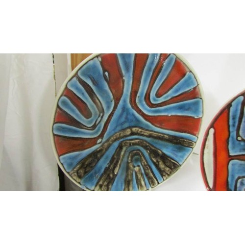 1364 - Two Poole pottery plates, 27 cm diameter.