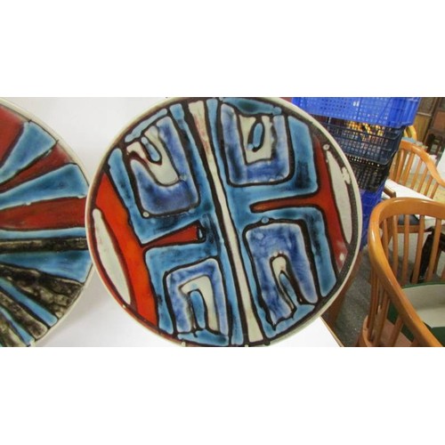 1364 - Two Poole pottery plates, 27 cm diameter.