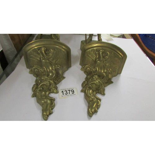 1379 - Two heavy brass Viking figures with two brass brackets.