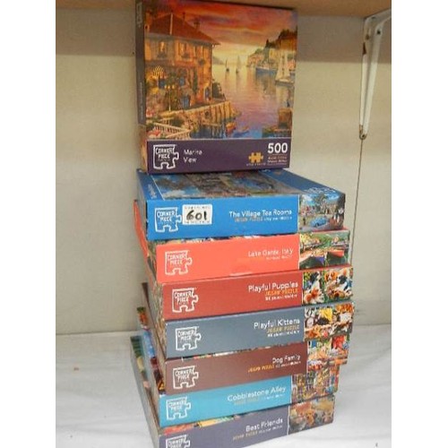 601 - Eight jigsaw puzzles, complete in bags.