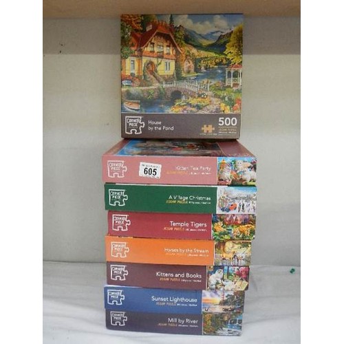 605 - Eight jigsaw puzzles, complete in bags.