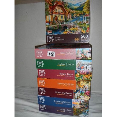 605 - Eight jigsaw puzzles, complete in bags.