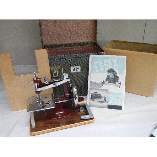 617 - A cased vintage 'Essex' sewing machine.