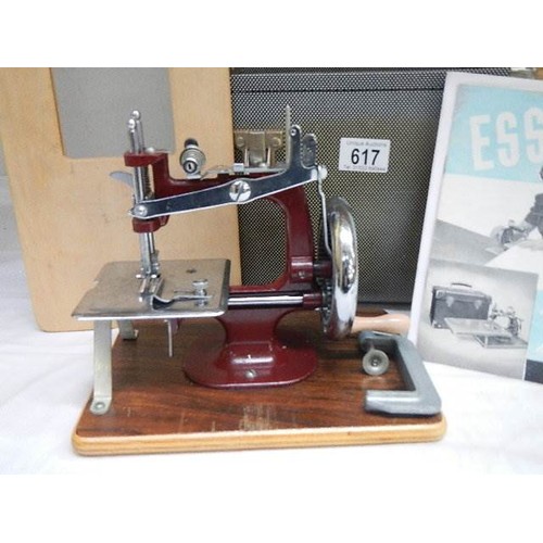 617 - A cased vintage 'Essex' sewing machine.