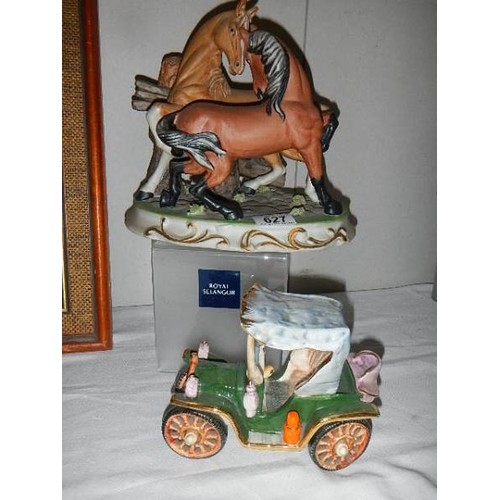 627 - A pair of ceramic fighting horses and a ceramic car.