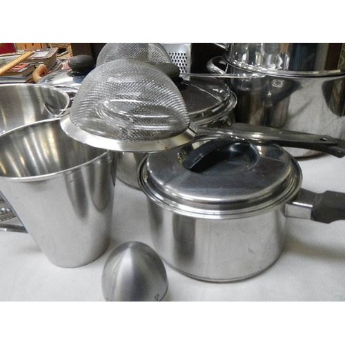 641 - A mixed lot of stainless steel pans, colander etc.,  COLLECT ONLY.