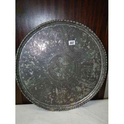 657 - A large silver plate on copper Indian tray (plate badly worn). COLLECT ONLY.