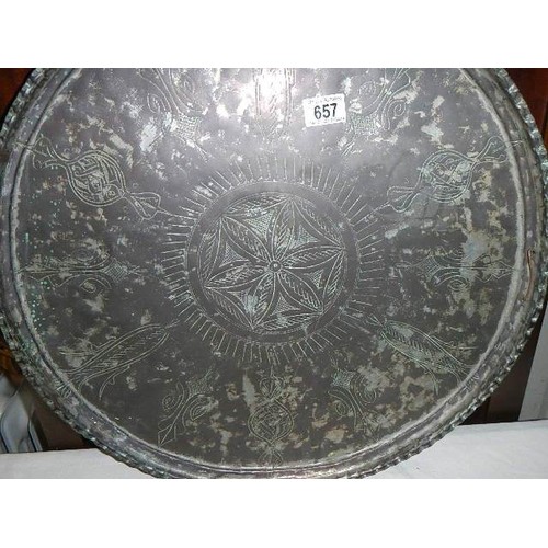 657 - A large silver plate on copper Indian tray (plate badly worn). COLLECT ONLY.