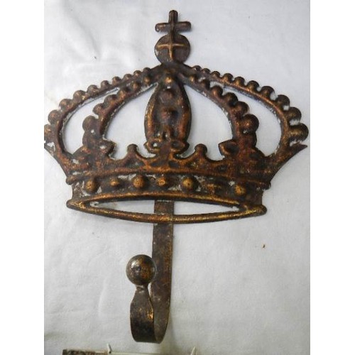 665 - A metal hook in the form of a crown and a Danish armorial tile.