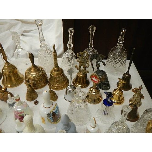 667 - Approximately 100 bells in brass, glass and china.  COLLECT ONLY.