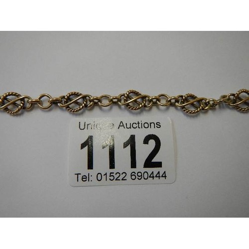 1112 - A 9ct gold fancy rope link bracelet, (tests as 9ct), 9 grams.