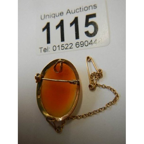 1115 - A 9ct gold female profile cameo brooch with safety chain,