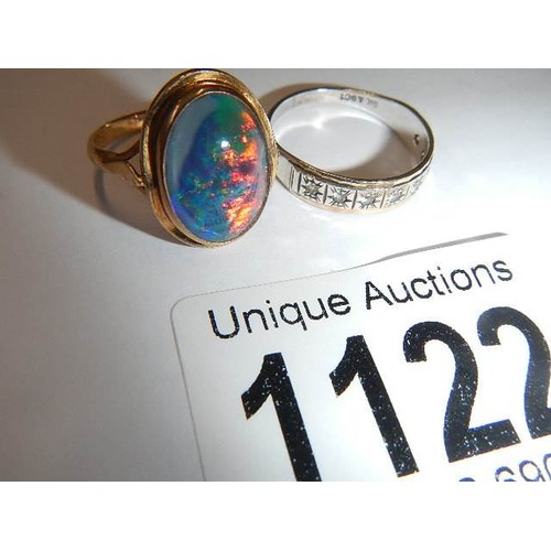 1122 - A 9ct gold ring set fire opal, size J half and a gold and silver ring, size N.