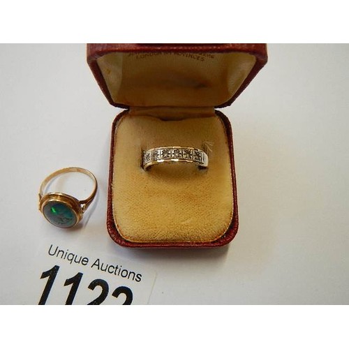 1122 - A 9ct gold ring set fire opal, size J half and a gold and silver ring, size N.