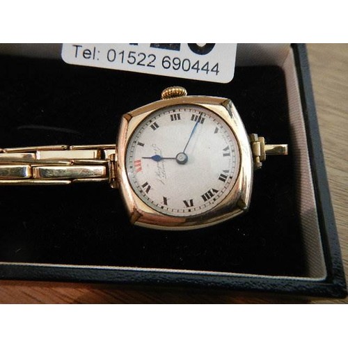 1125 - A 9ct gold ladies wrist watch on gold bracelet marked J Kar? Liverpool.