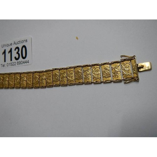 1130 - A 9ct gold bracelet with floral pattern, in good condition, 18 grams.