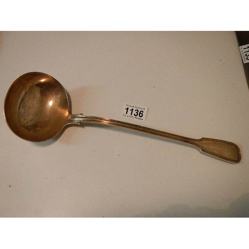 1136 - A large hall marked silver ladle, 300 grams.