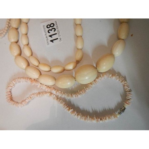 1138 - A large bead bone necklace and two coral necklaces.