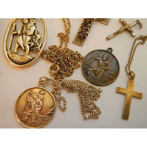 1142 - A mixed lot of crosses, St. Christopher's etc., including two silver.