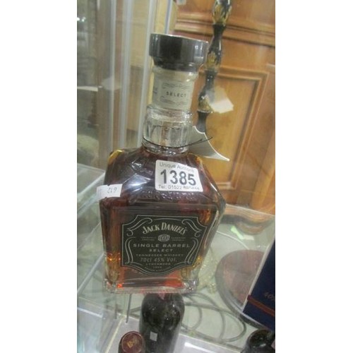 1385 - A bottle of Jack Daniels single barrel select Tennessee whisky and a boxed Bells LE whisky, Christma... 