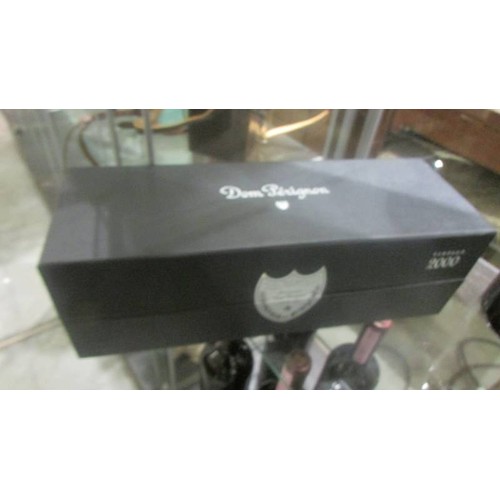 1389 - A boxed (unopened) 2000 bottle of Dom Perignon champagne and a bottle of Dom Perignon Rose' (1996). ... 