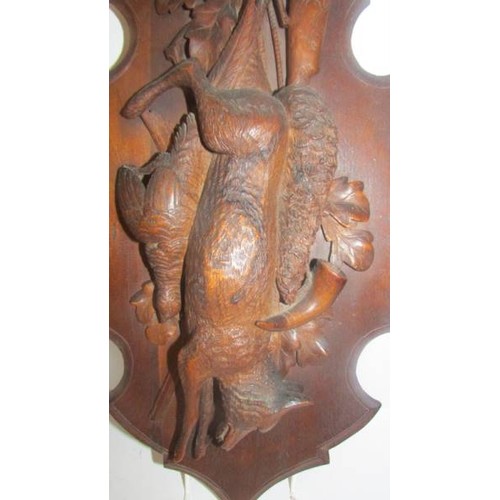 1401 - A carved oak hunting themed wall panel.