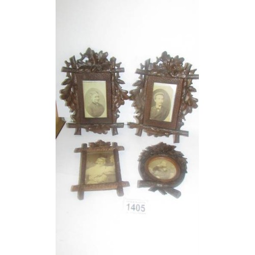 1405 - Four carved wood photograph frames.