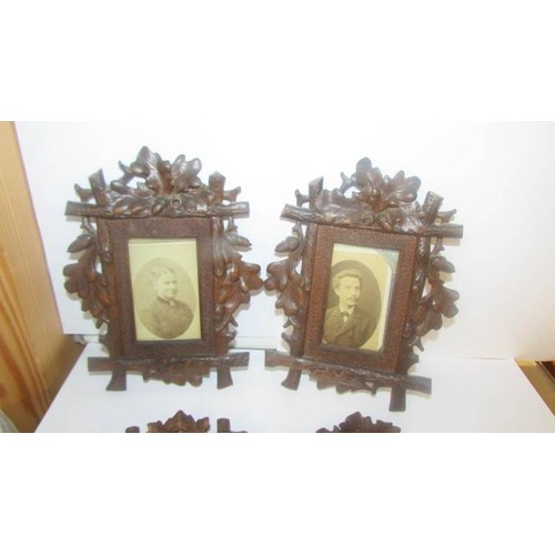 1405 - Four carved wood photograph frames.