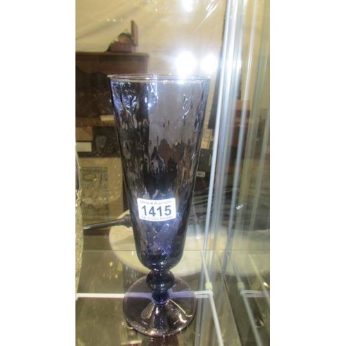 1415 - A heavy cut glass vase, 26 cm and a blue glass vase, 30 cm.