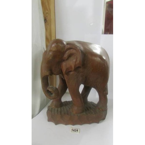 1424 - A carved wood elephant. COLLECT ONLY.