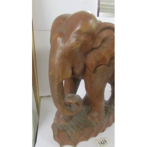 1424 - A carved wood elephant. COLLECT ONLY.