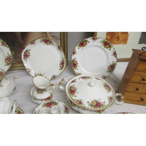 1446 - In excess of 90 piecesof Royal Albert Old Country Roses tea and dinner ware.  COLLECT ONLY.