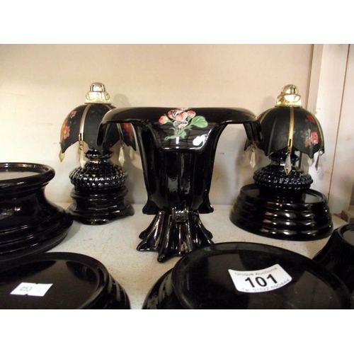 101 - A quantity of black glass (vase) stands